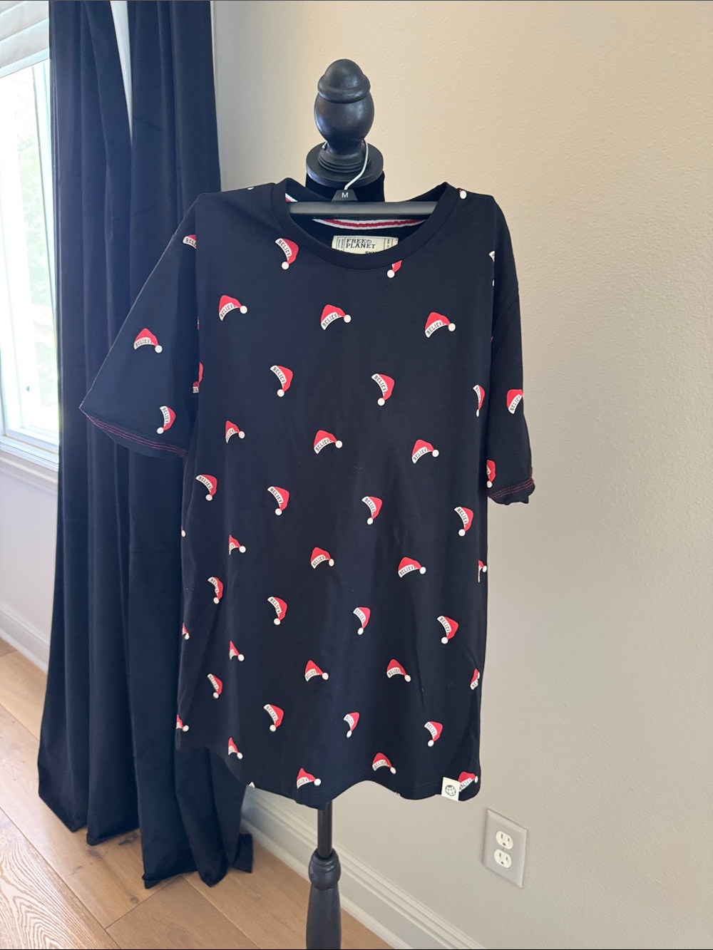 Free Planet Black Short Sleeve Tee with Red Santa Hat Print